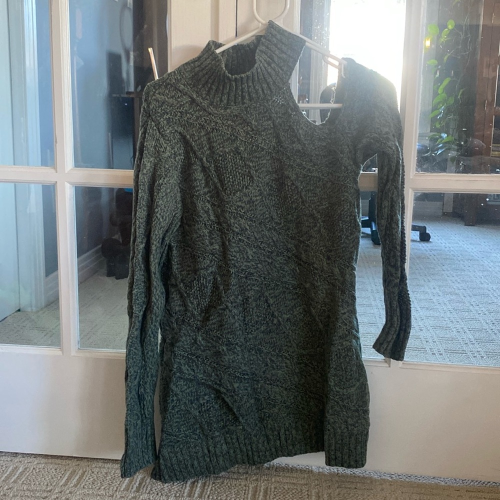 Green high neck sweater with one shoulder cut out
